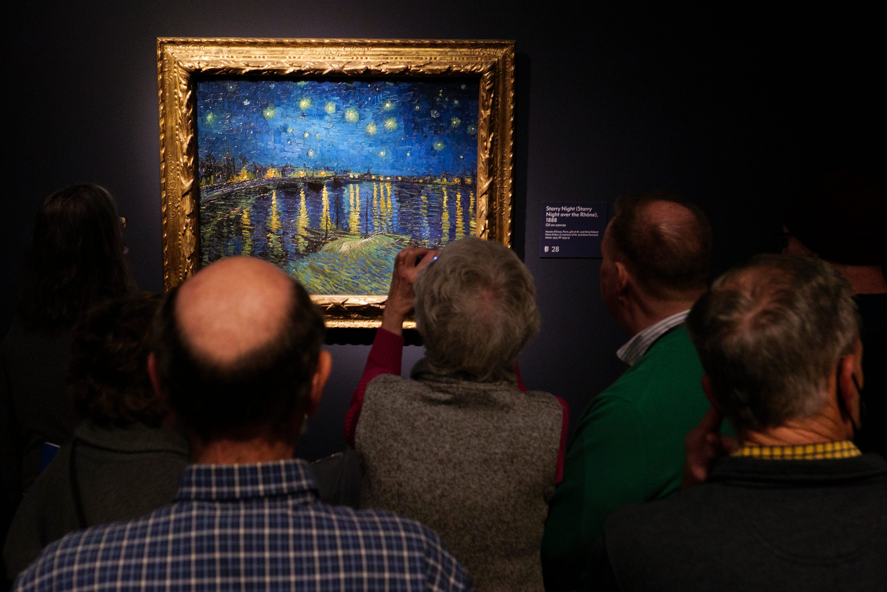 Visitors view Starry Night (Starry Night over the Rhone), 1888, at the Van Gogh in America exhibit at the Detroit institute of Arts, Wednesday, Jan. 11, 2023.