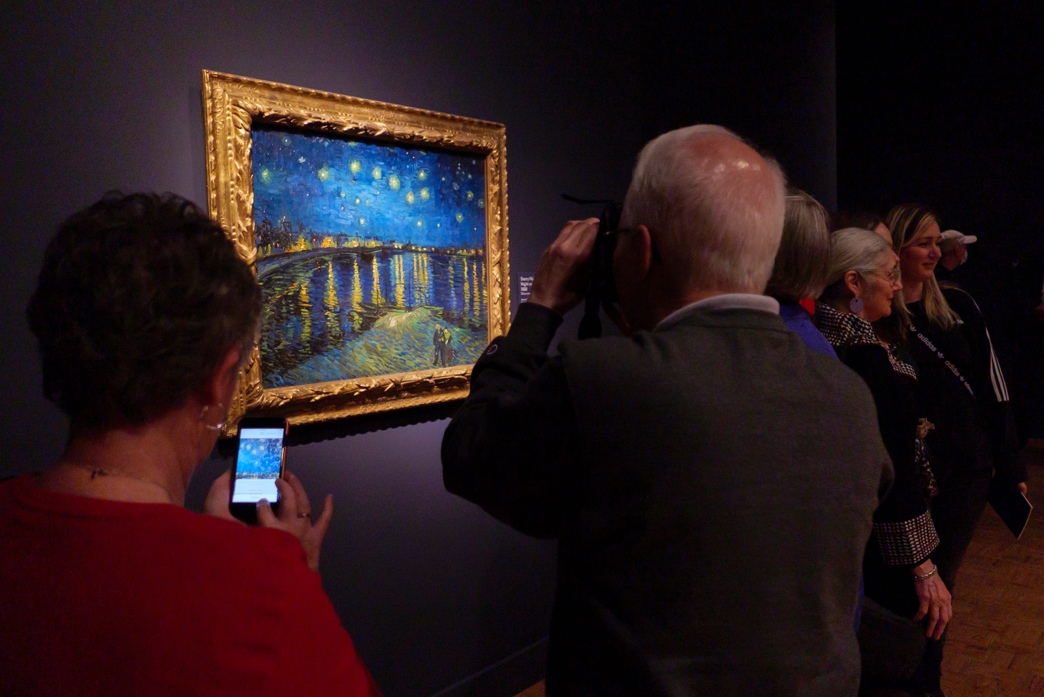 Visitors view Starry Night (Starry Night over the Rhone), 1888, at the Van Gogh in America exhibit at the Detroit institute of Arts, Wednesday, Jan. 11, 2023.