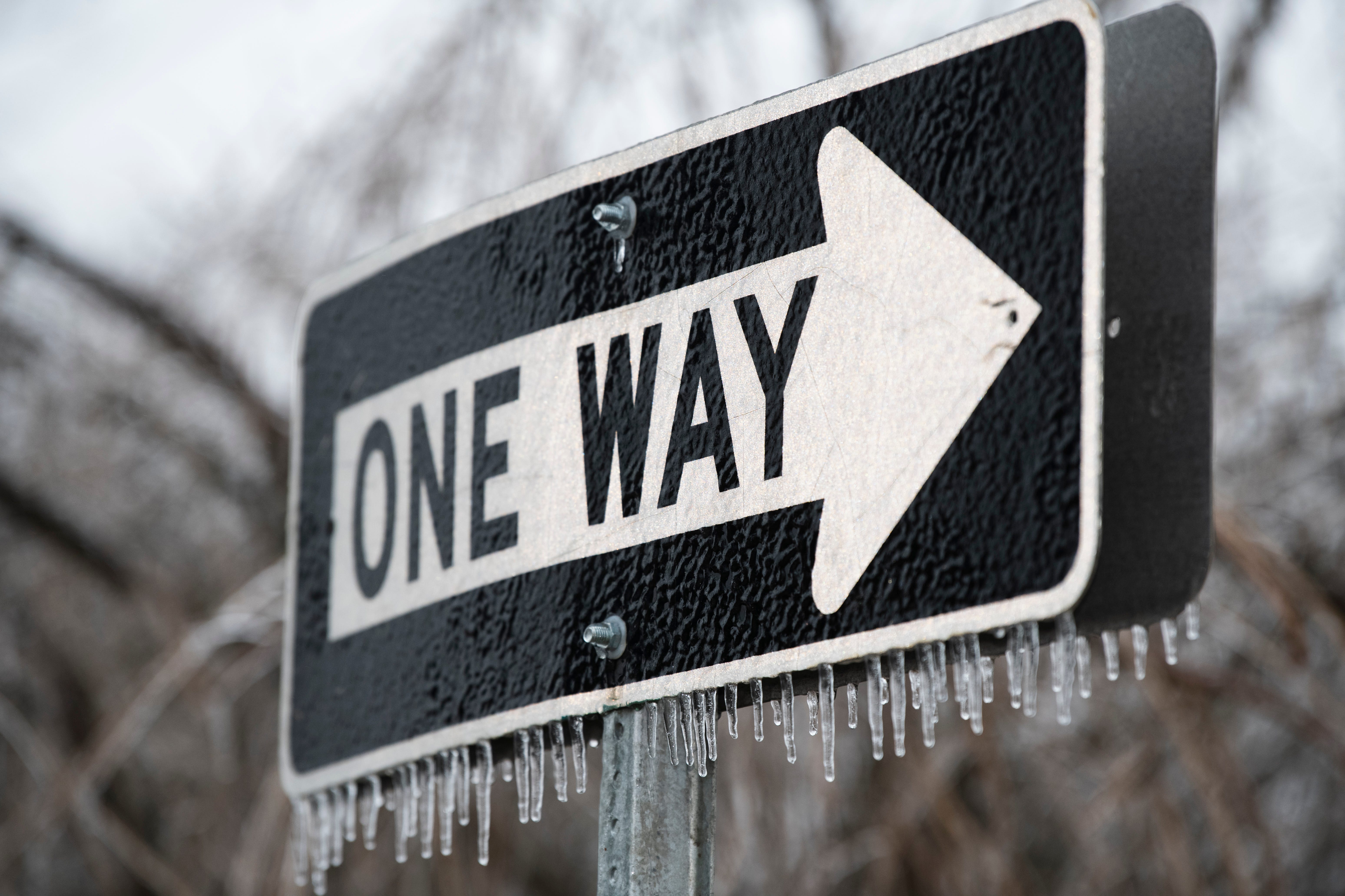 Icicles hang from a One-Way road sign in Grosse Pointe Woods on the morning of Thursday, February 23, 2023 after freezing rain coated Metro Detroit communities over night.