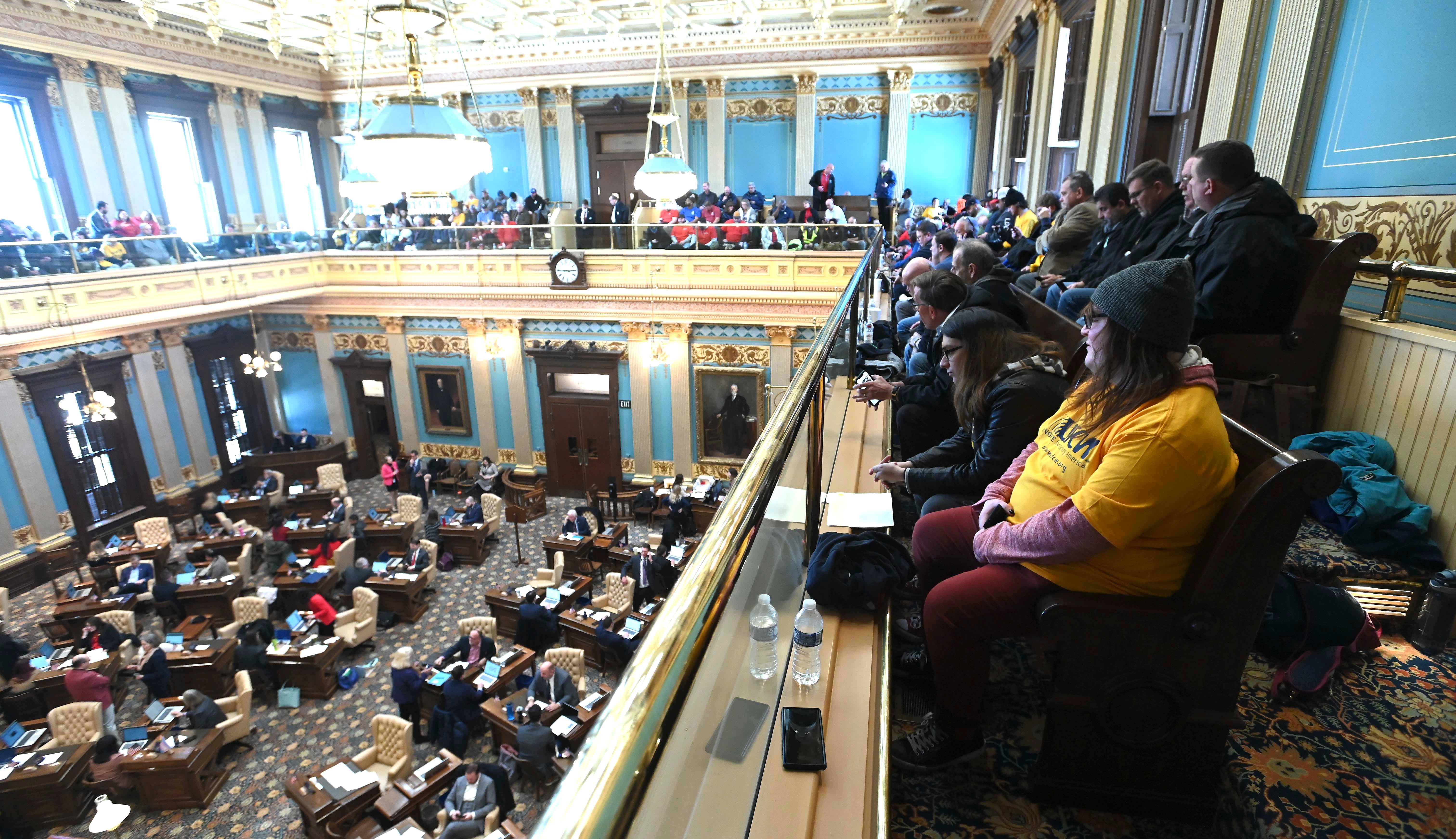 Union members and supporters talk as they wait for the Senate to vote, Tuesday afternoon, March 14, 2023.