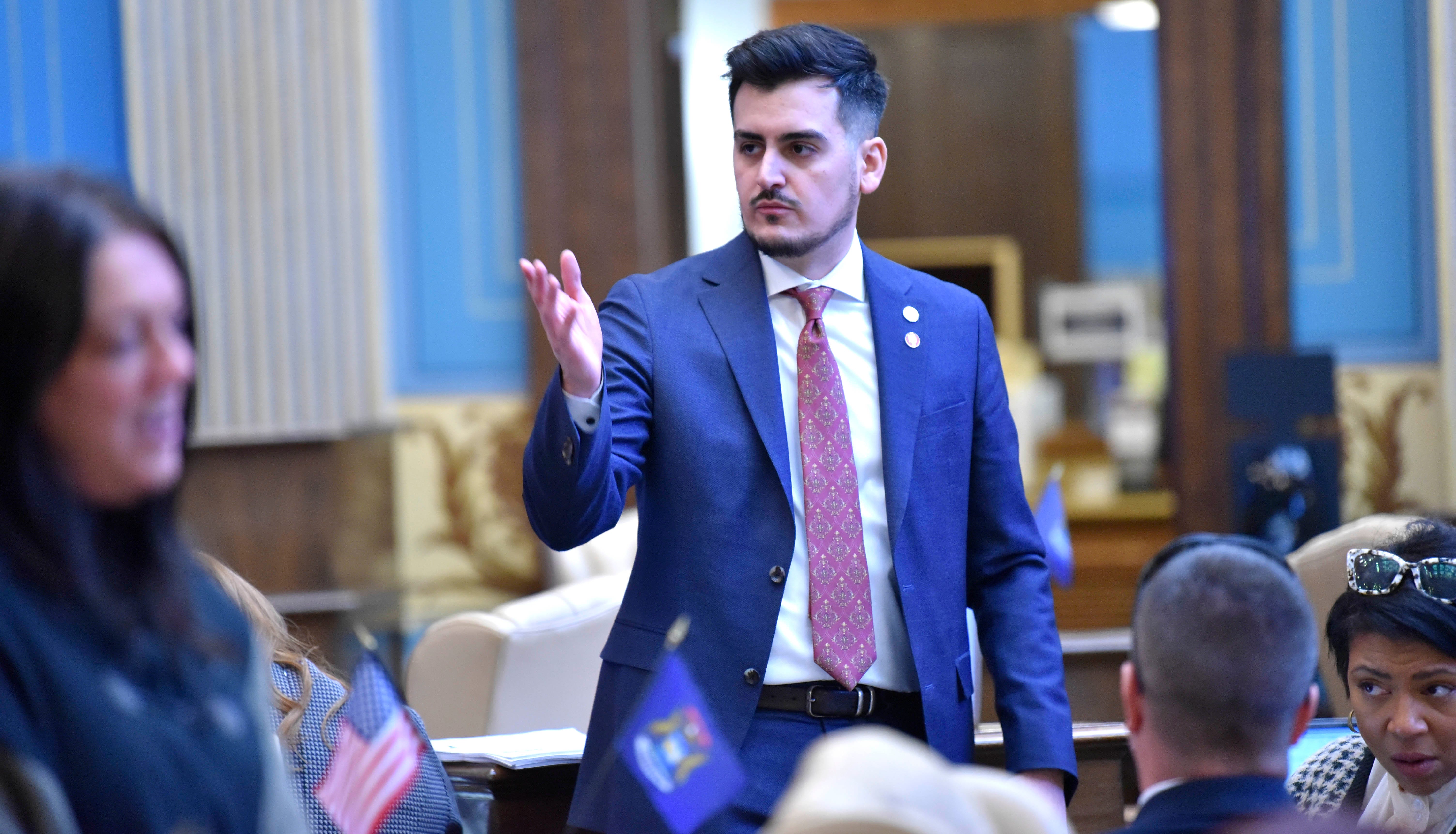 State Senator Darrin Camilleri stands as he talks to others, Tuesday morning, March 14, 2023.