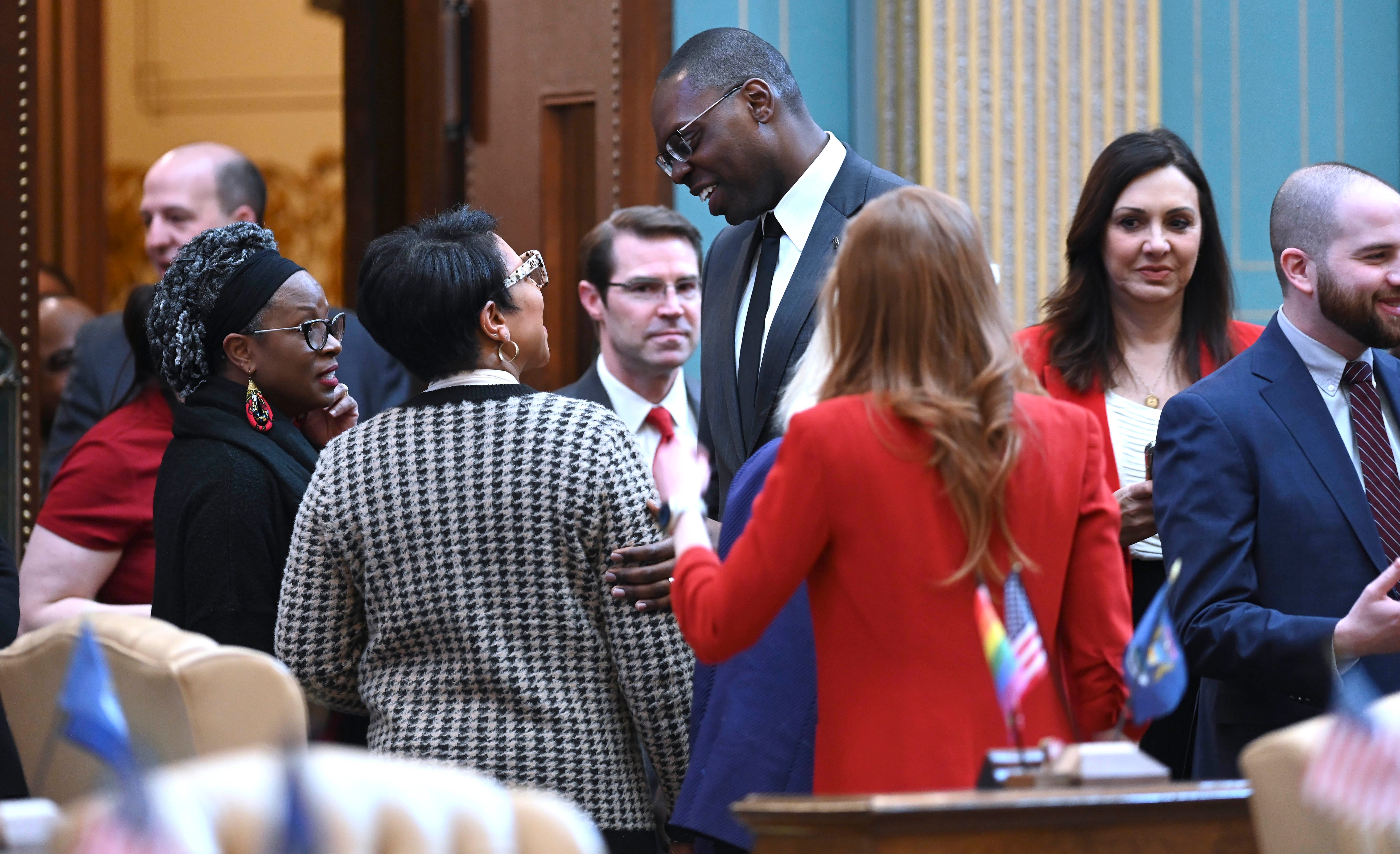 Lt. Gov. Garlin Gilchrist, II, center, talks with law makers, Tuesday morning, March 14, 2023.